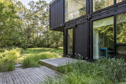 a view of a backyard with sitting area