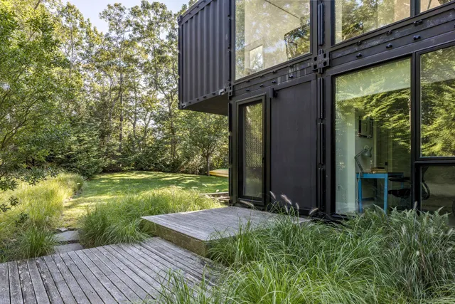a view of a backyard with sitting area