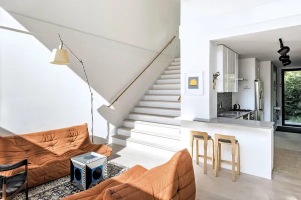 a living room with furniture and a table