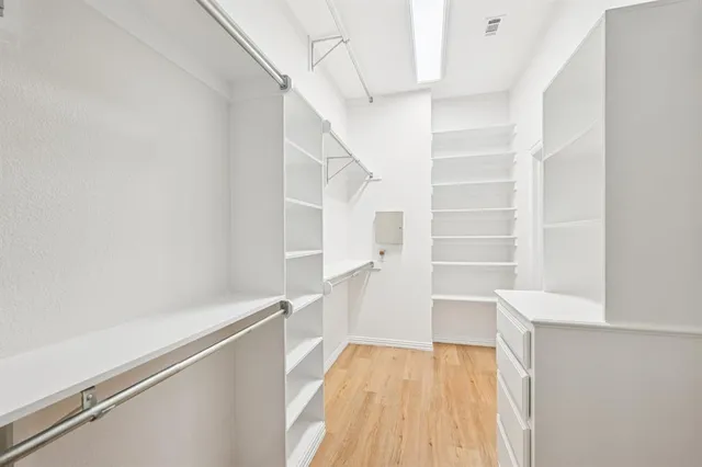a view of staircase with white walls and a window
