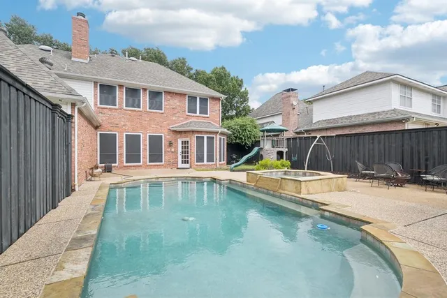 a view of a house with swimming pool