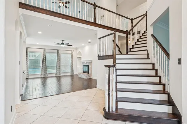 a view of staircase with white walls and a window