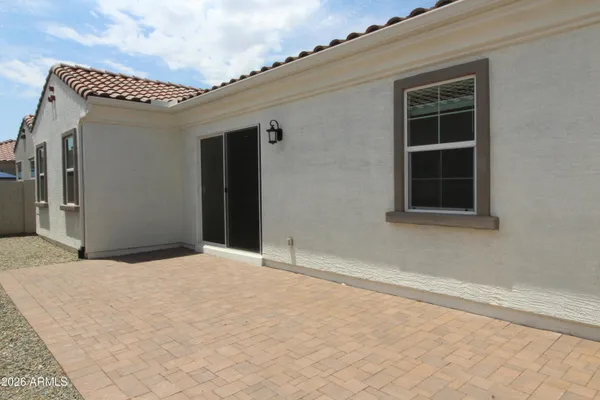 a view of a house with a swimming pool and a yard