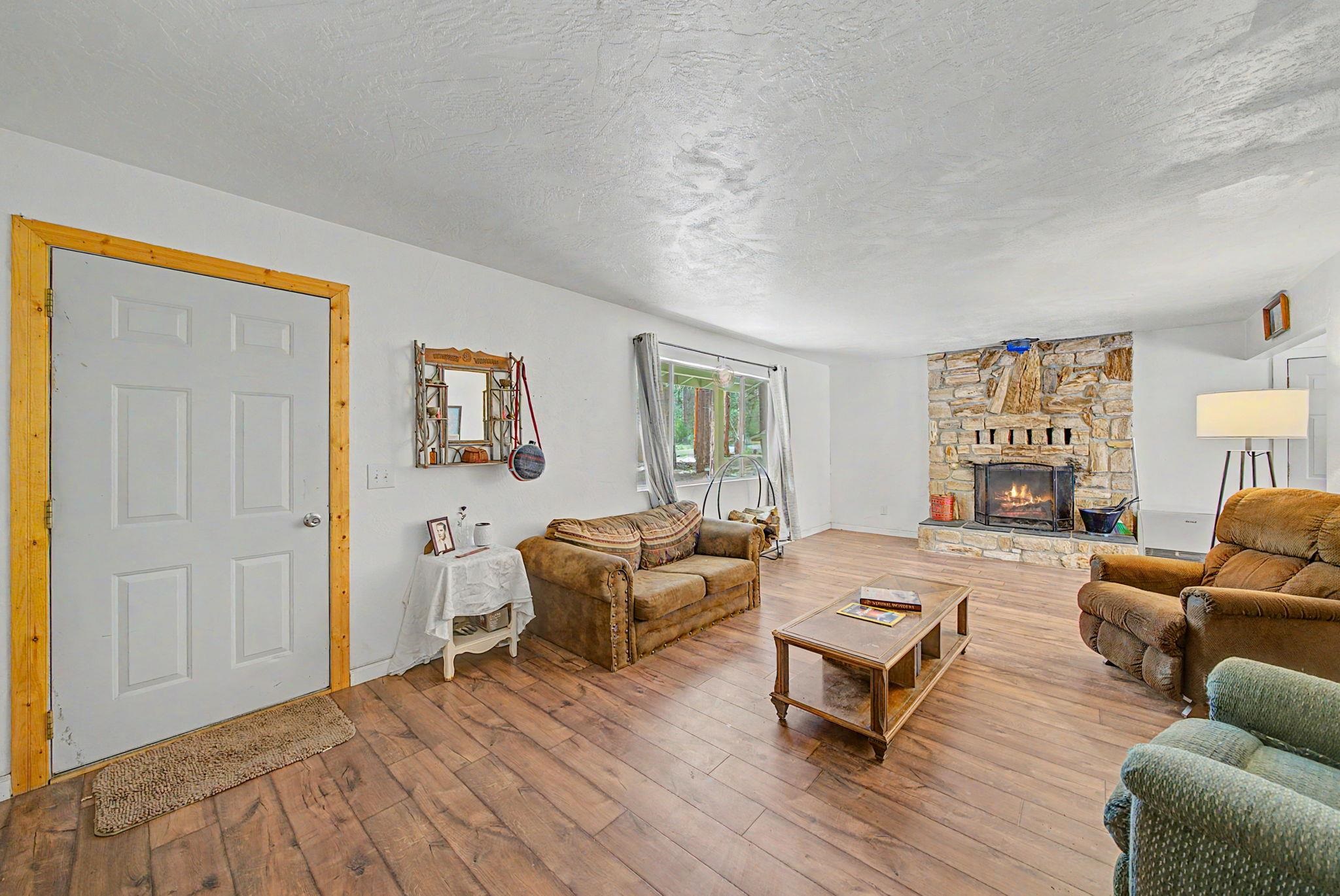 58374 Gill Ranch Road Cromberg, CA 96103 - Photo 33 of 44 a living room with furniture and a wooden floor