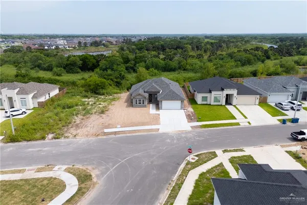 an aerial view of a house with a swimming pool