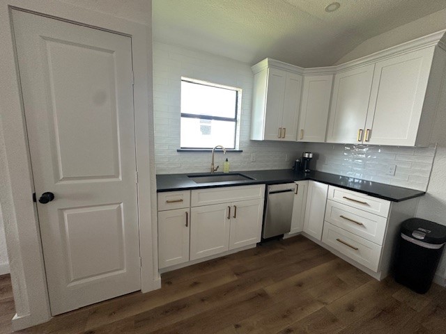 1311 East 35th Street Houston, TX 77022 - Photo 5 of 12 a kitchen with granite countertop white cabinets white appliances and sink