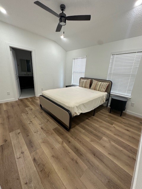 1311 East 35th Street Houston, TX 77022 - Photo 10 of 12 a spacious bedroom with a bed and a ceiling fan