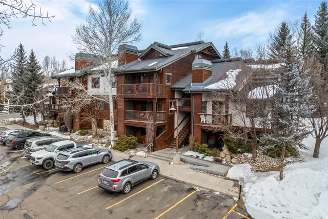 a car parked in front of a houses