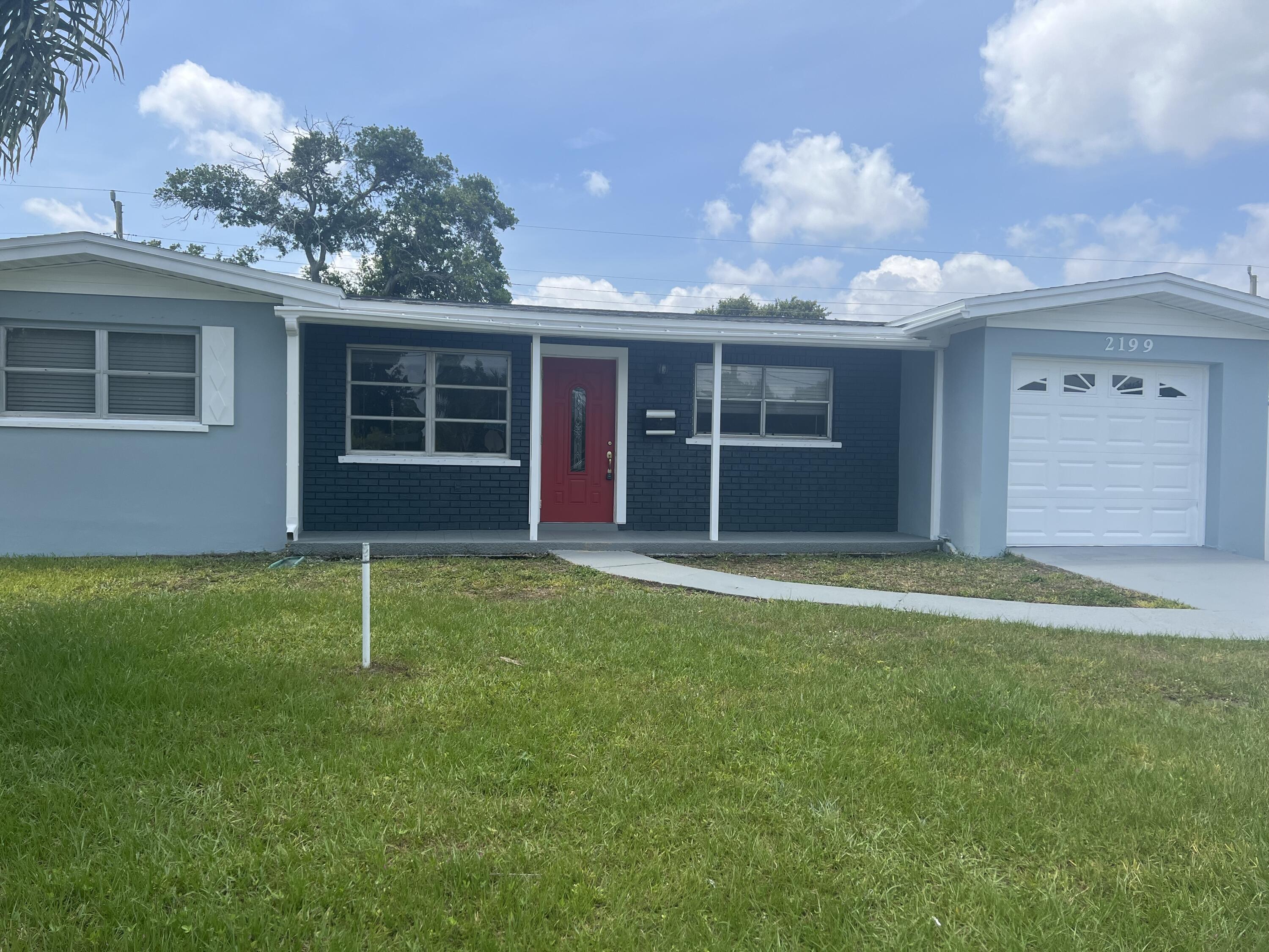 2199 Fatzler Road Melbourne, FL 32935 - Photo 1 of 23 a backyard of a house with barbeque oven and plants