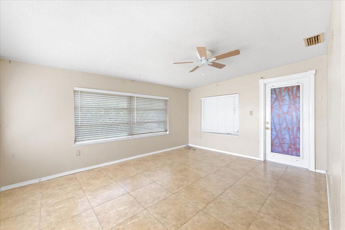 2199 Fatzler Road Melbourne, FL 32935 - Photo 15 of 23 a view of an empty room with a window