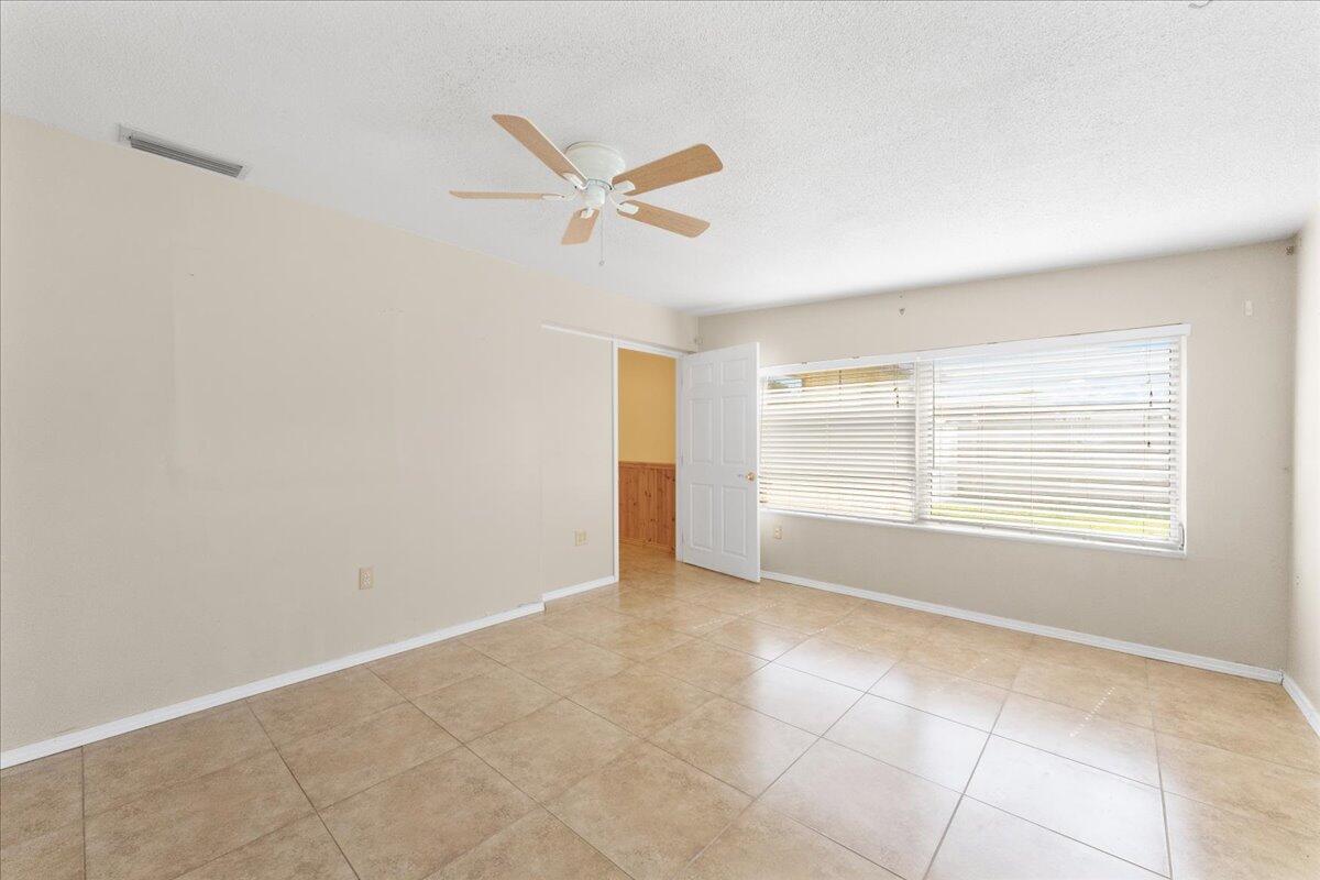 2199 Fatzler Road Melbourne, FL 32935 - Photo 16 of 23 a view of an empty room with a window