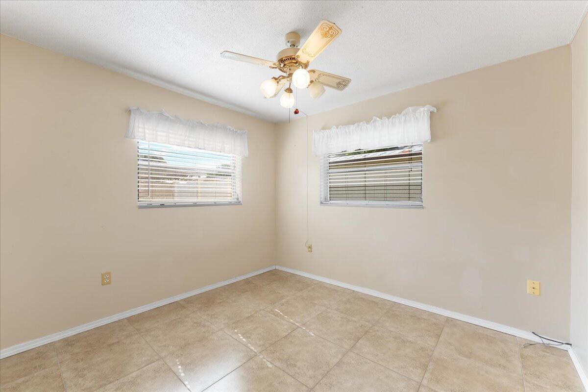 2199 Fatzler Road Melbourne, FL 32935 - Photo 18 of 23 a view of an empty room with a window