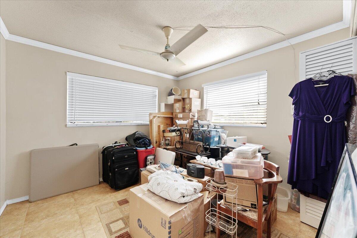 2199 Fatzler Road Melbourne, FL 32935 - Photo 20 of 23 a living room with furniture and a window