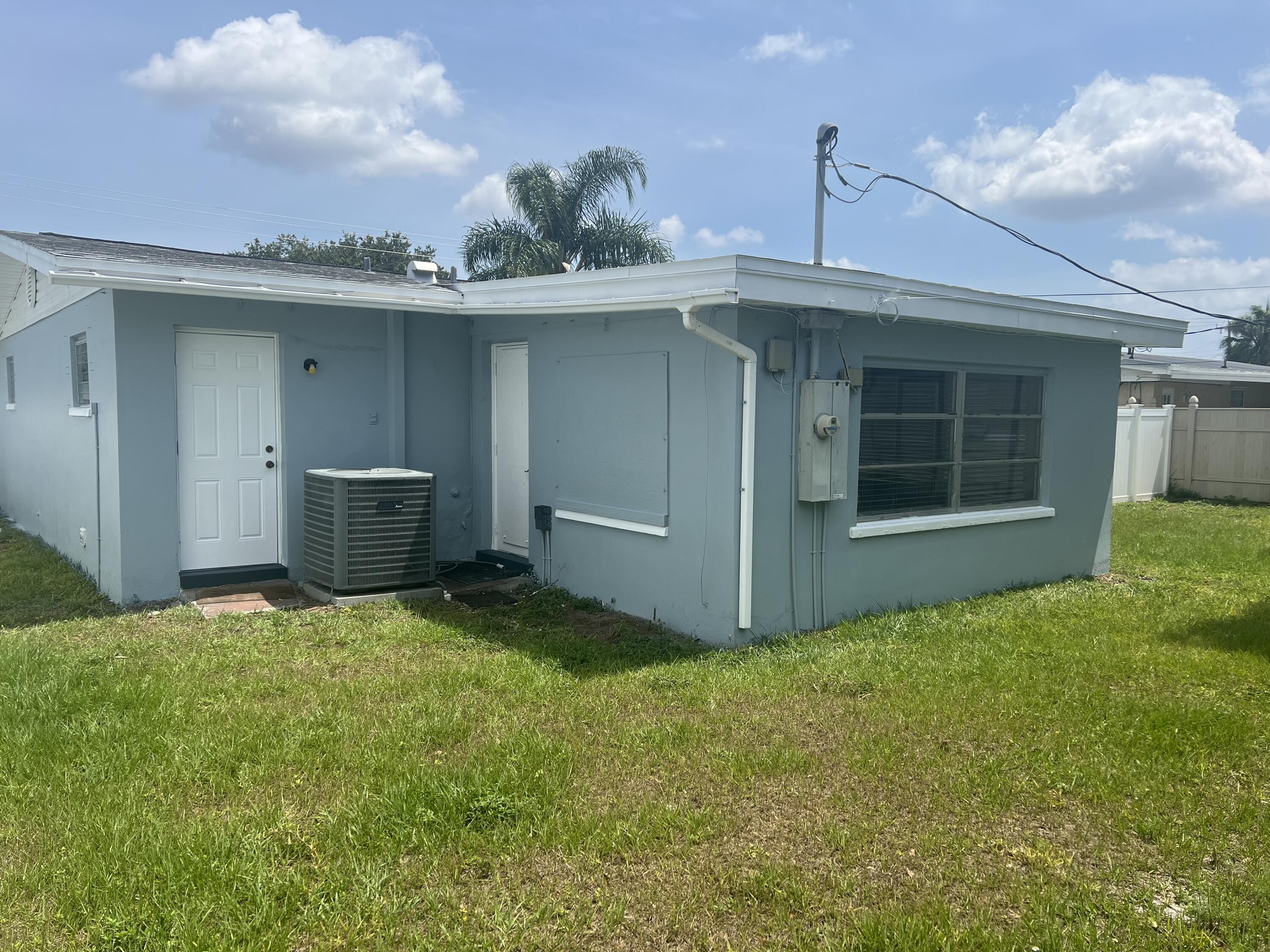 2199 Fatzler Road Melbourne, FL 32935 - Photo 21 of 23 a backyard of a house with table and chairs