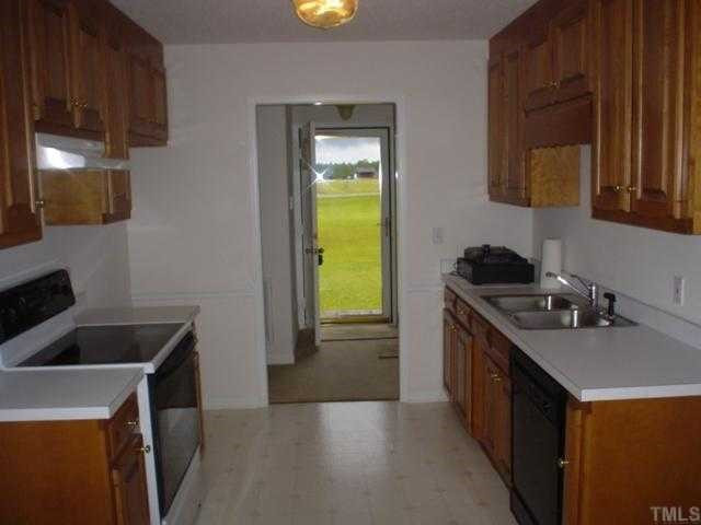 Nice size kitchen that features smooth top range & dishwasher. Kitchen