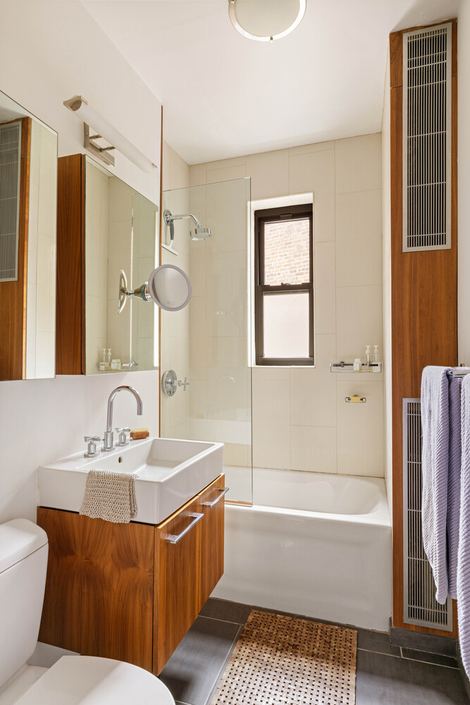 21 Butler Place, Unit 4E Brooklyn, NY 11238 - Photo 9 of 11 a bathroom with a bathtub and a sink