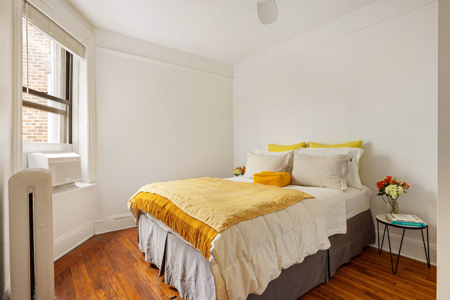 21 Butler Place, Unit 4E Brooklyn, NY 11238 - Photo 7 of 11 a bedroom with a bed and wooden floor