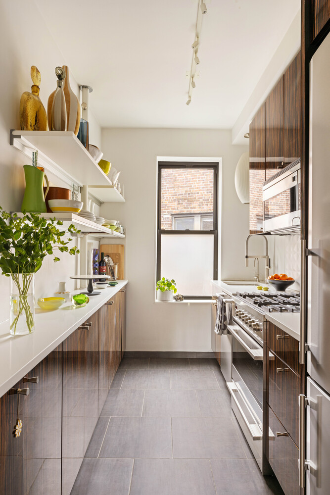 21 Butler Place, Unit 4E Brooklyn, NY 11238 - Photo 8 of 11 a kitchen with stainless steel appliances a sink and a stove