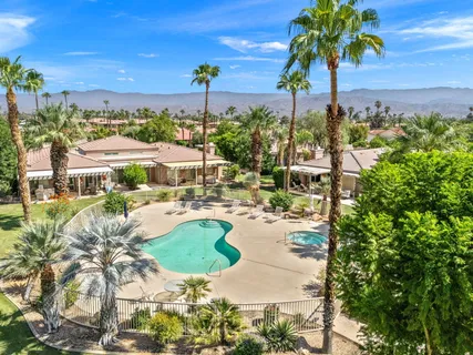 a view of a swimming pool with a patio