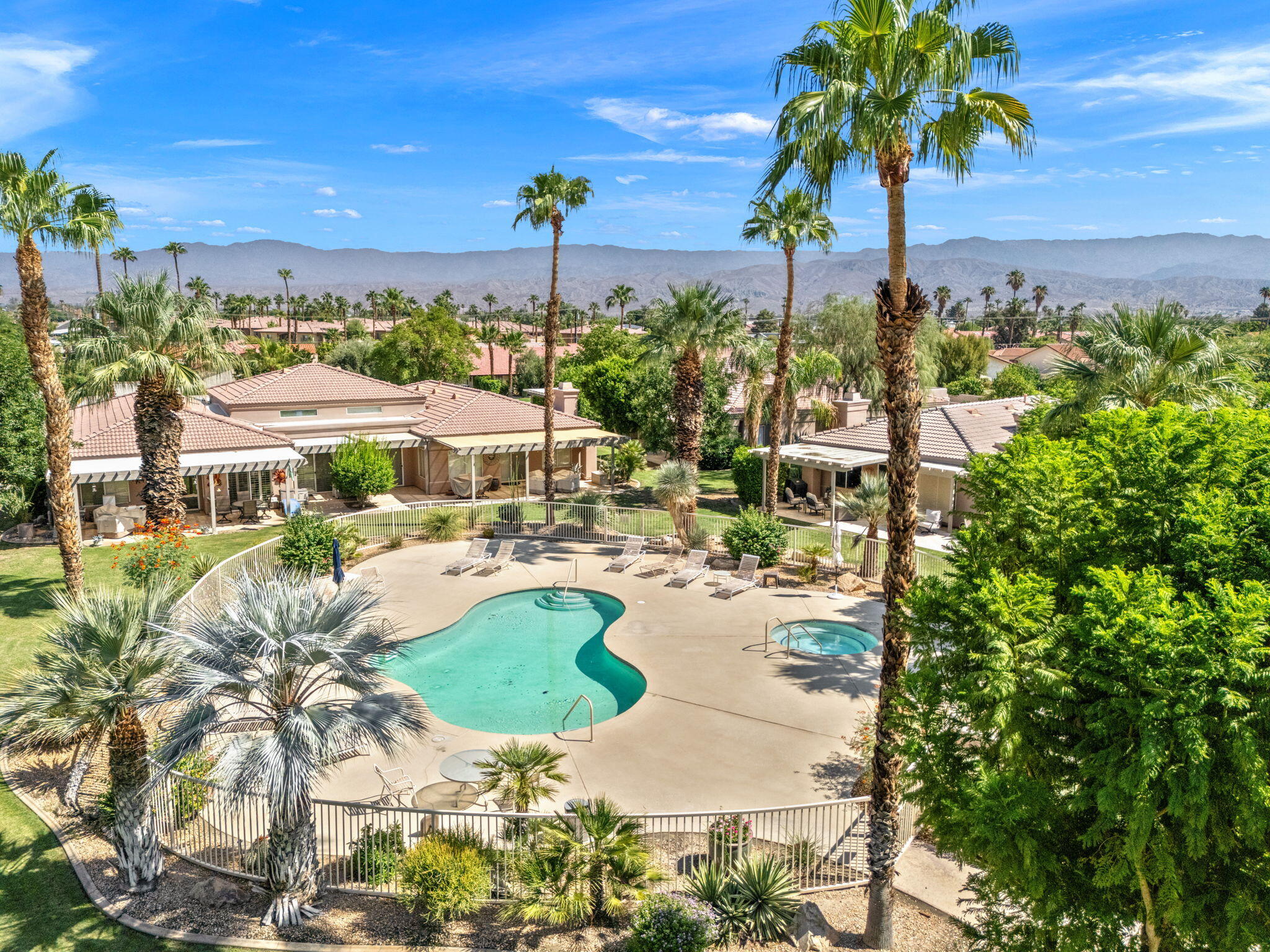 a view of a swimming pool with a patio