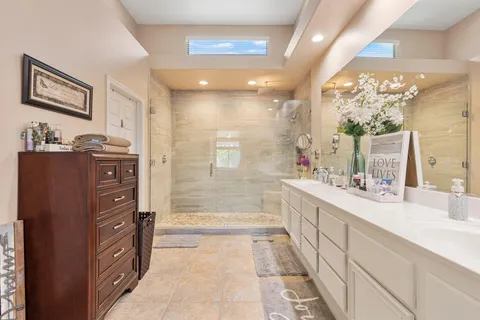 a bedroom with a bed and a television