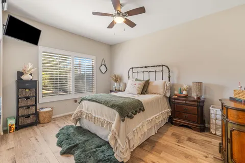 a bathroom with a double vanity sink toilet and shower