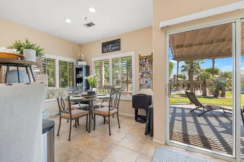 a view of a dining room with furniture window and outside view