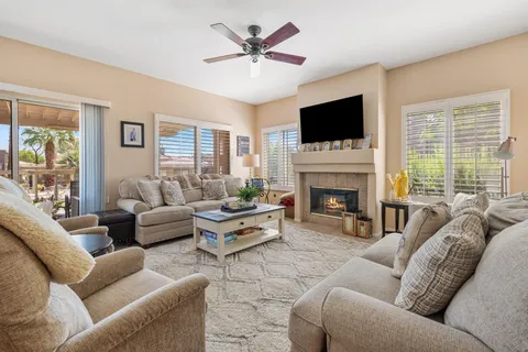 a living room with furniture fireplace and a flat screen tv
