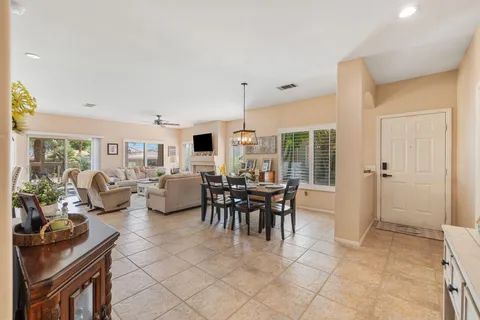 a bedroom with furniture and a flat screen tv