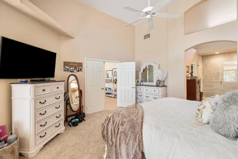 a bathroom with a sink a mirror and a shower