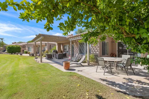 a view of a park with large trees