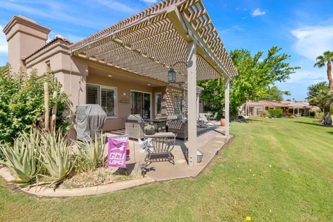 a front view of a house with a yard and a garage