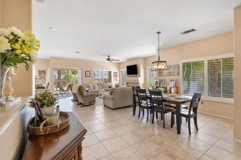 a view of a dining room with furniture window and outside view