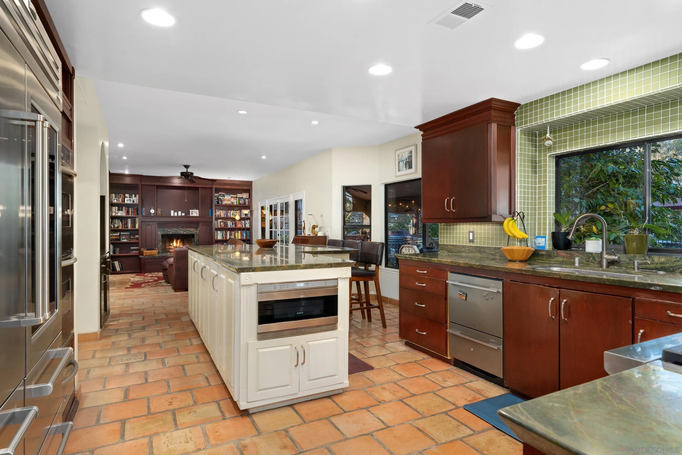 1027 Summer Holly Lane Encinitas, CA 92024 - Photo 12 of 29 a kitchen with stainless steel appliances granite countertop a stove and a sink