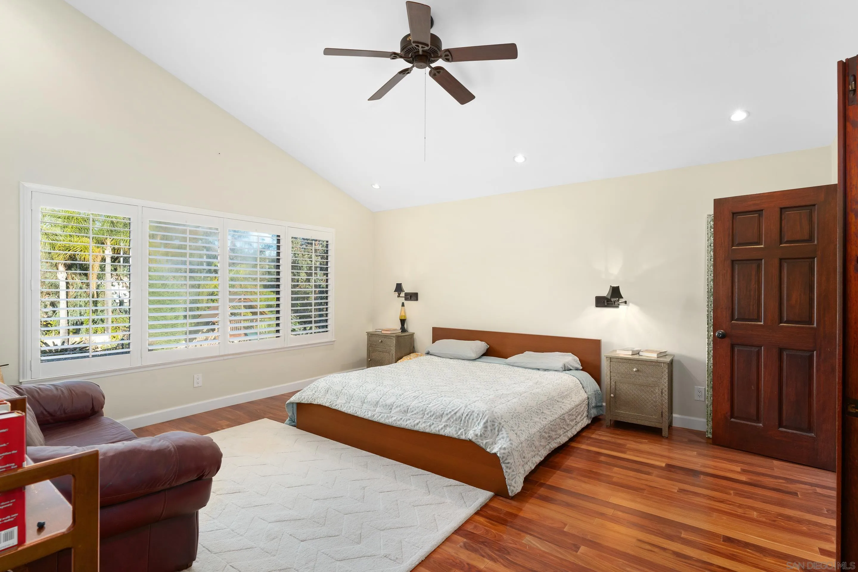 1027 Summer Holly Lane Encinitas, CA 92024 - Photo 15 of 29 a bedroom with a bed and wooden floor