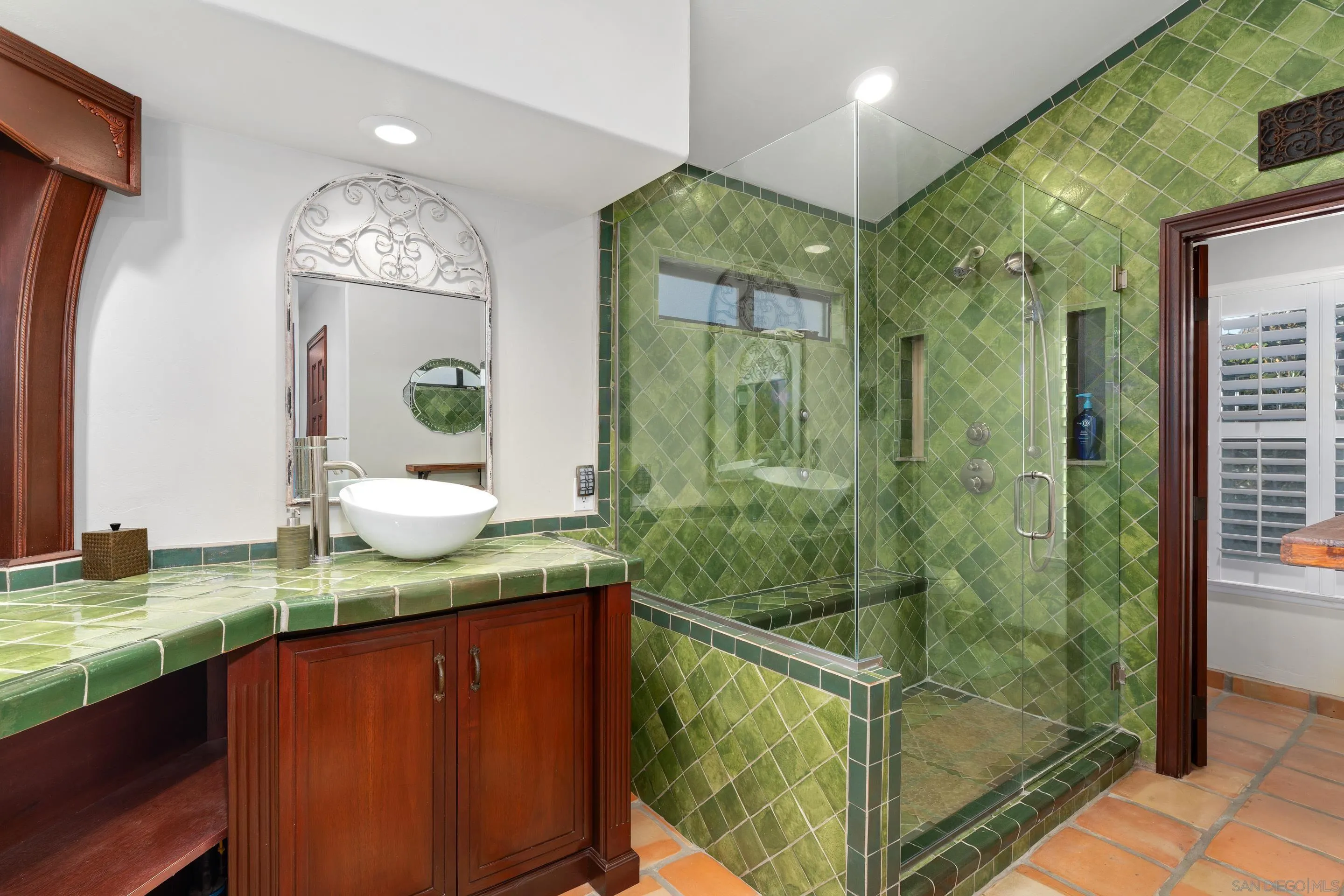 1027 Summer Holly Lane Encinitas, CA 92024 - Photo 16 of 29 a bathroom with sink shower and mirror