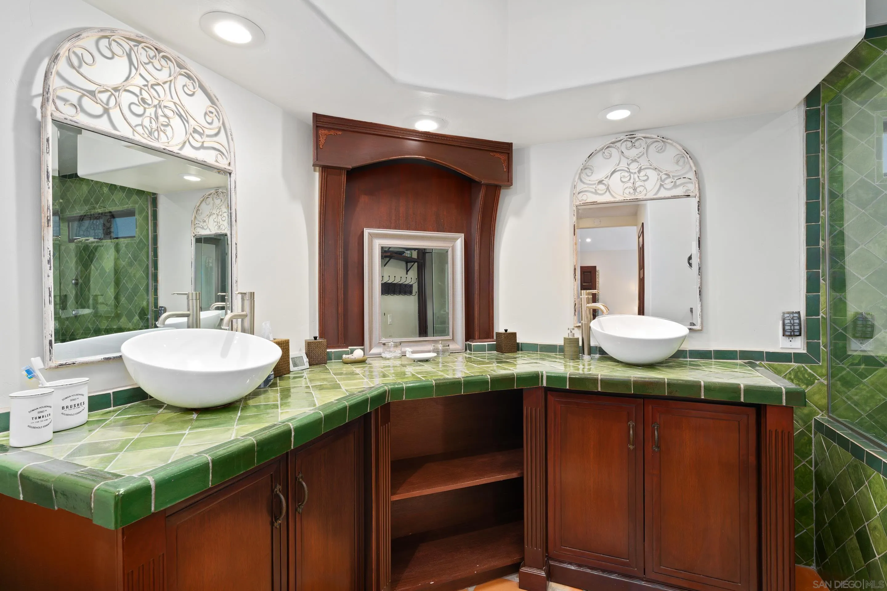 1027 Summer Holly Lane Encinitas, CA 92024 - Photo 17 of 29 a bathroom with a granite countertop sink and a mirror
