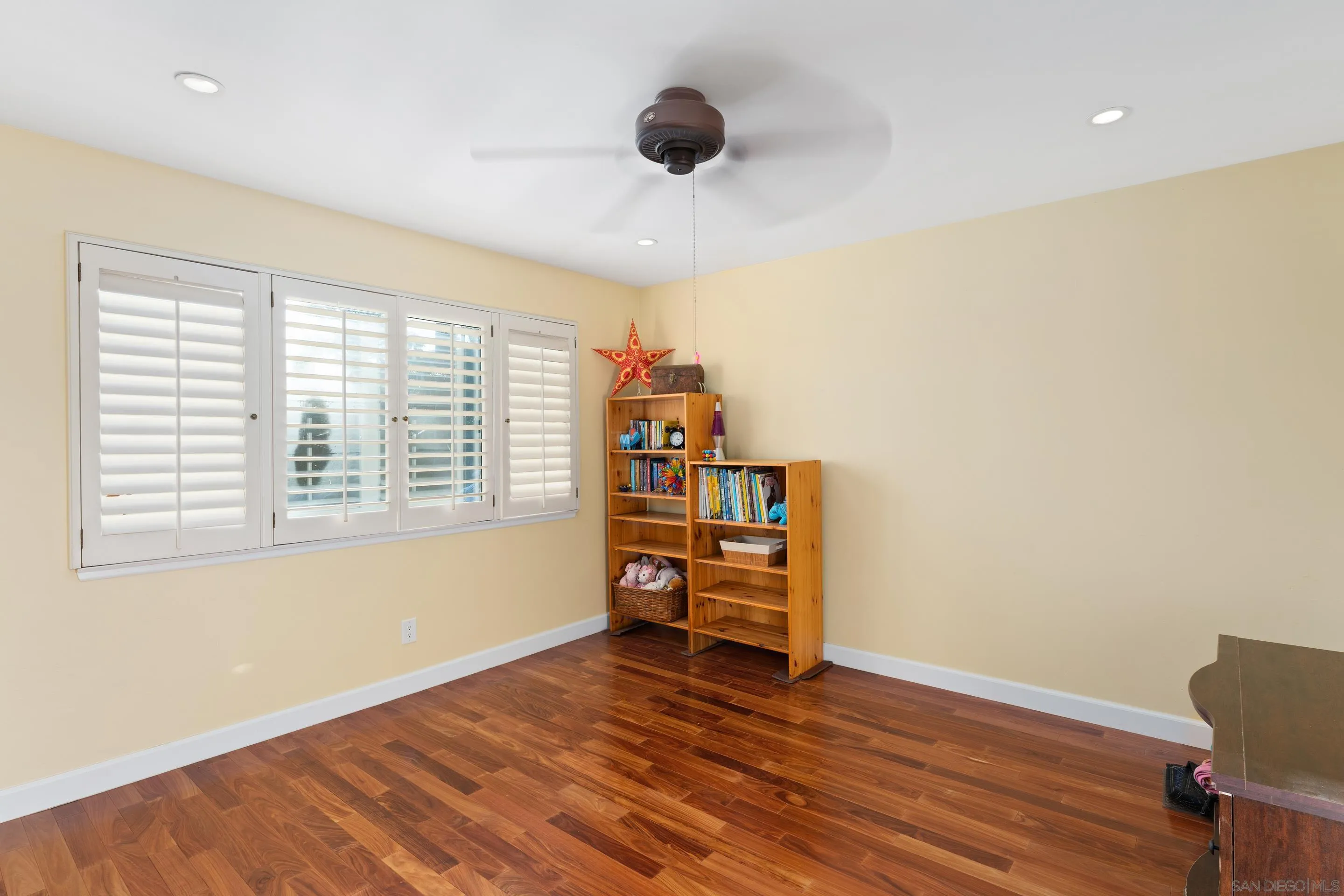 1027 Summer Holly Lane Encinitas, CA 92024 - Photo 20 of 29 a view of an empty room with wooden floor and a window