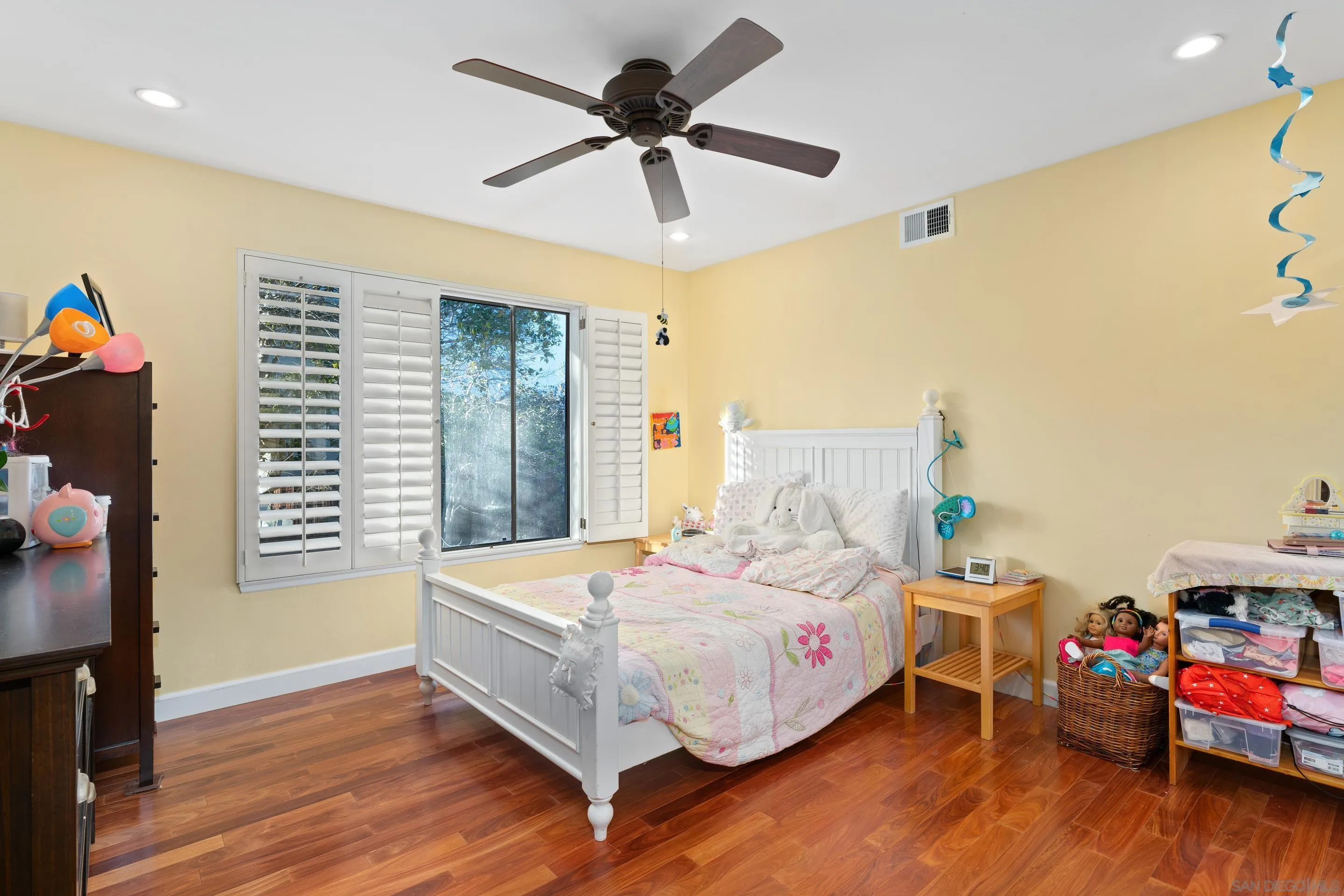 1027 Summer Holly Lane Encinitas, CA 92024 - Photo 21 of 29 a bedroom with furniture and a wooden floor