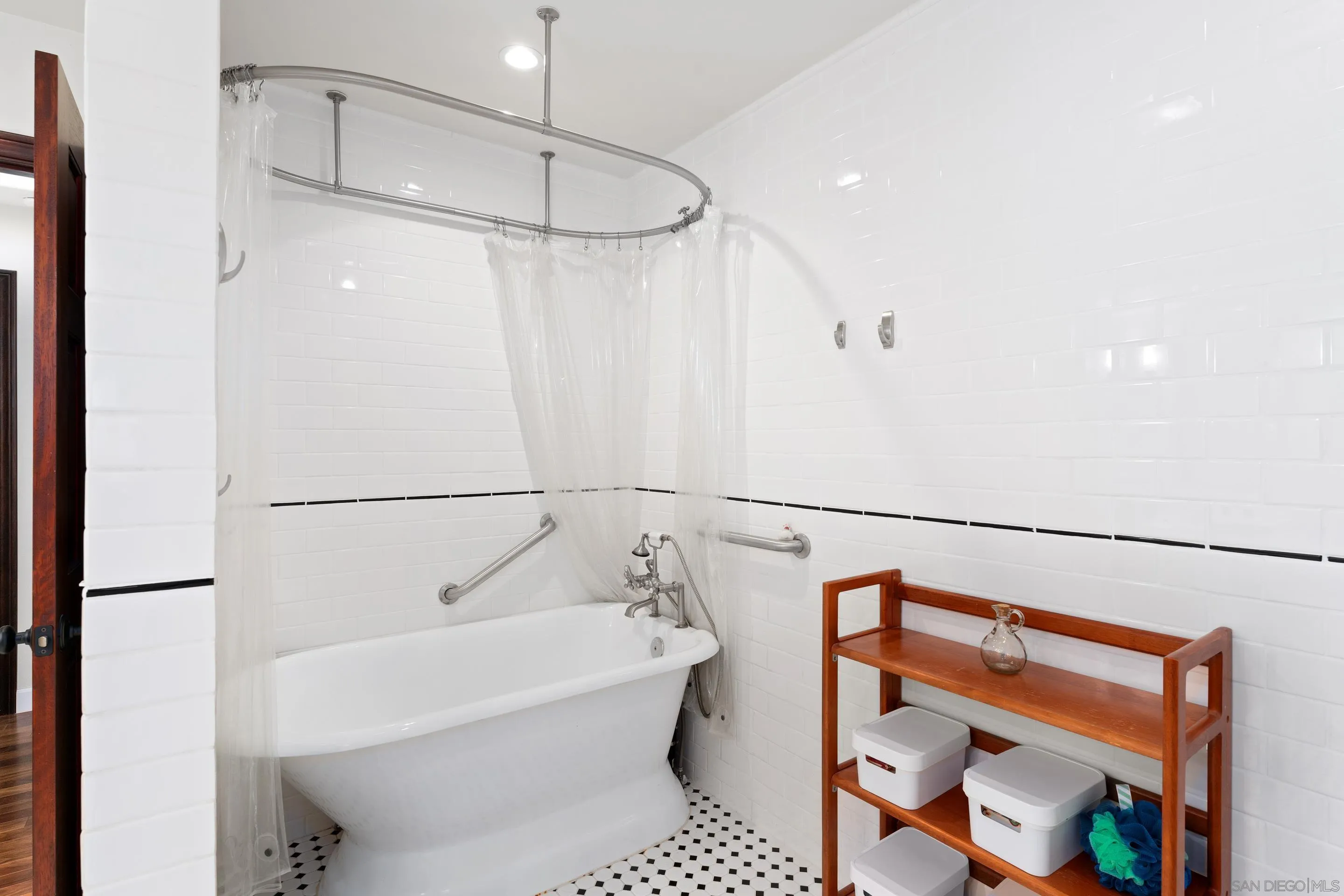 1027 Summer Holly Lane Encinitas, CA 92024 - Photo 23 of 29 a bathroom with a bathtub and a shower