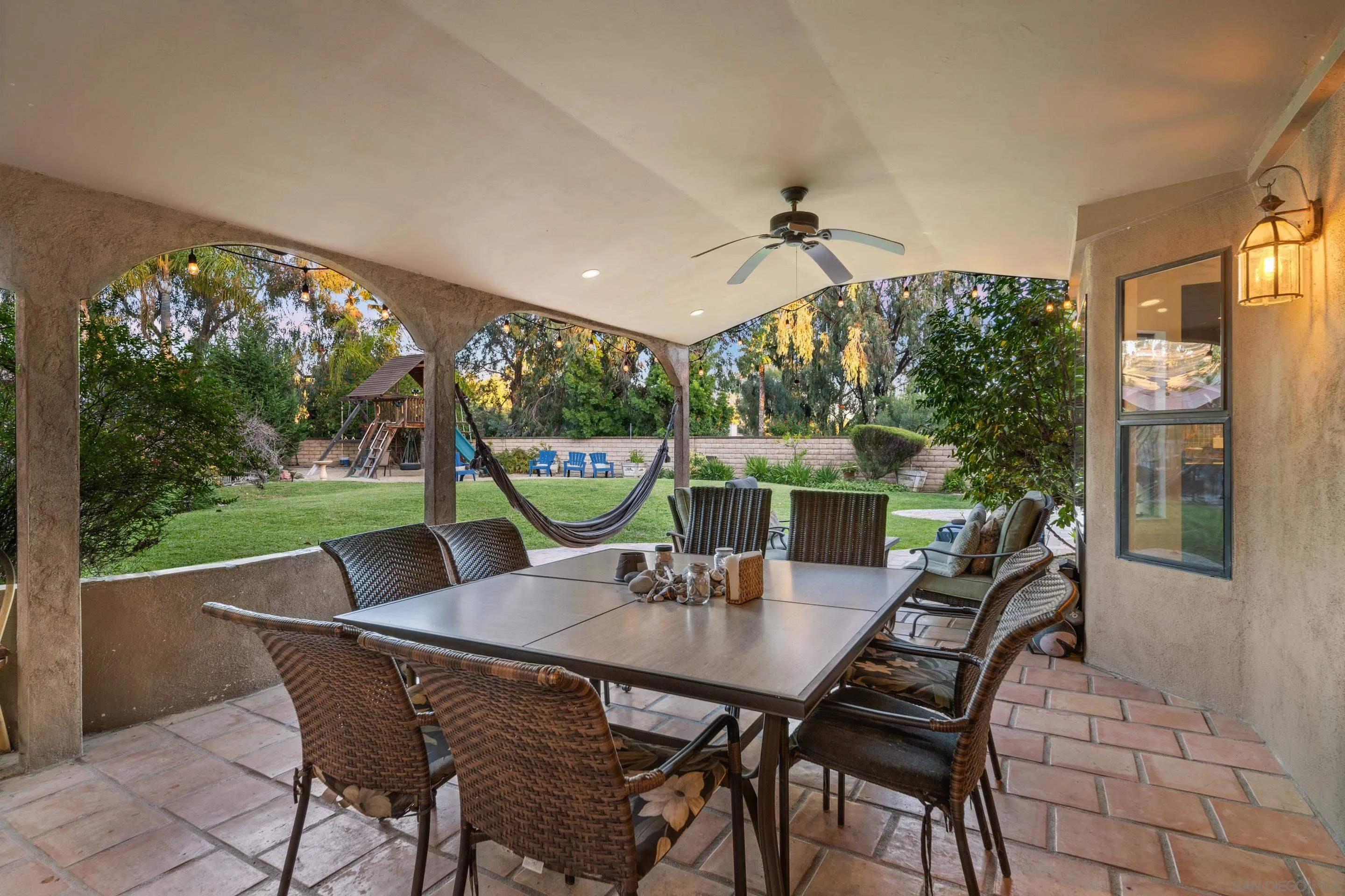 1027 Summer Holly Lane Encinitas, CA 92024 - Photo 24 of 29 a view of an outdoor dining space with a table and chairs