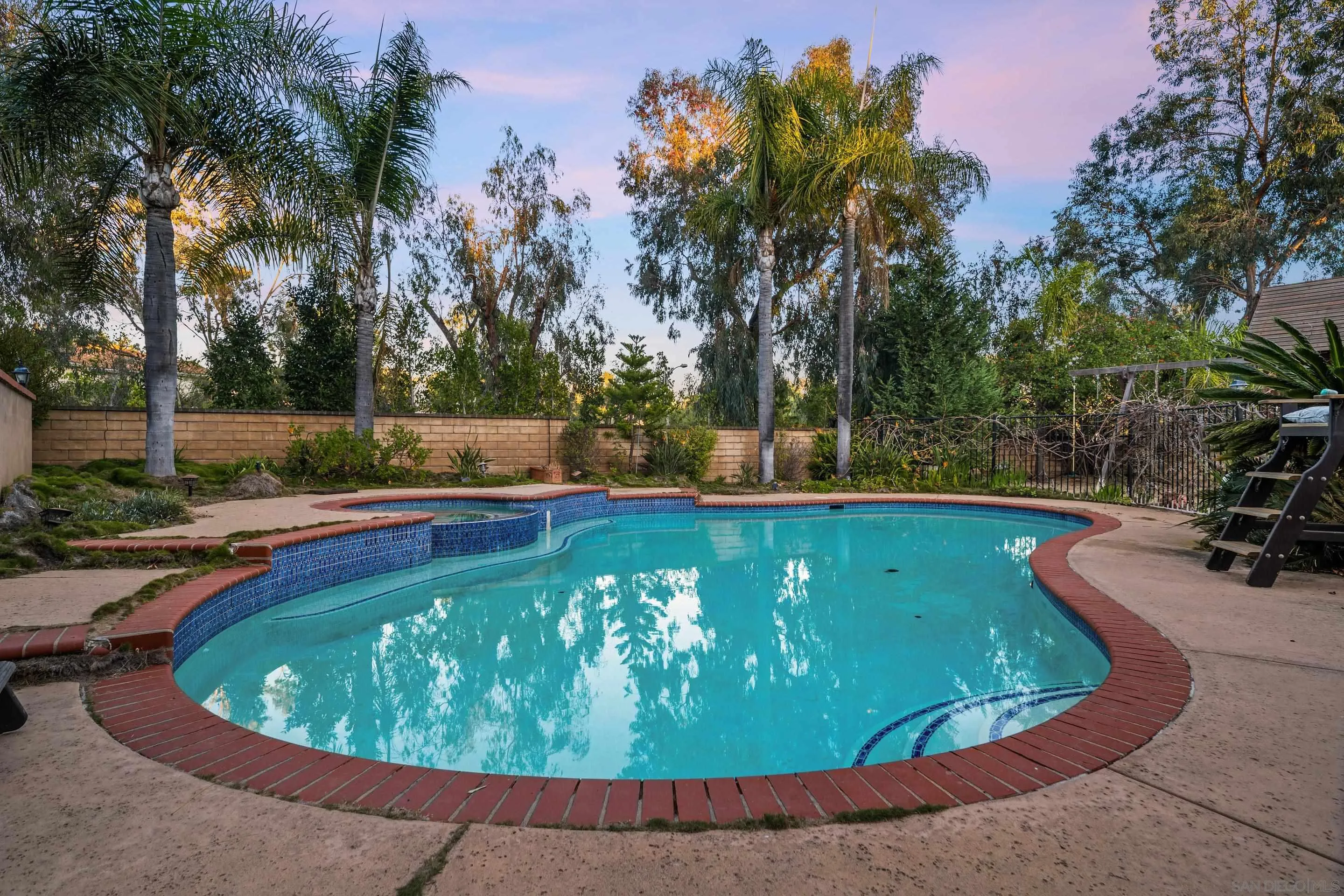 1027 Summer Holly Lane Encinitas, CA 92024 - Photo 28 of 29 a view of a swimming pool with a yard