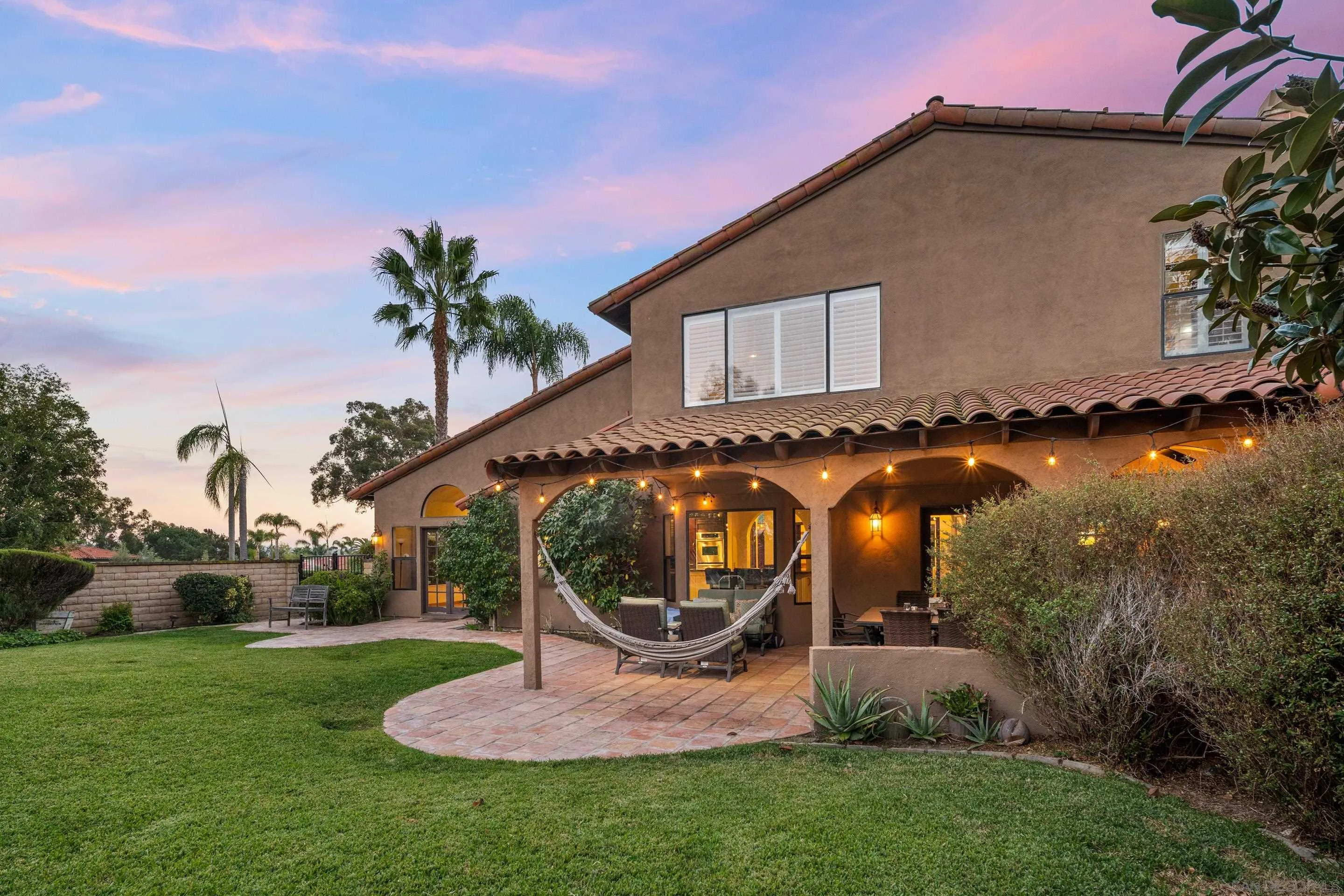 1027 Summer Holly Lane Encinitas, CA 92024 - Photo 29 of 29 a front view of a house with garden and patio