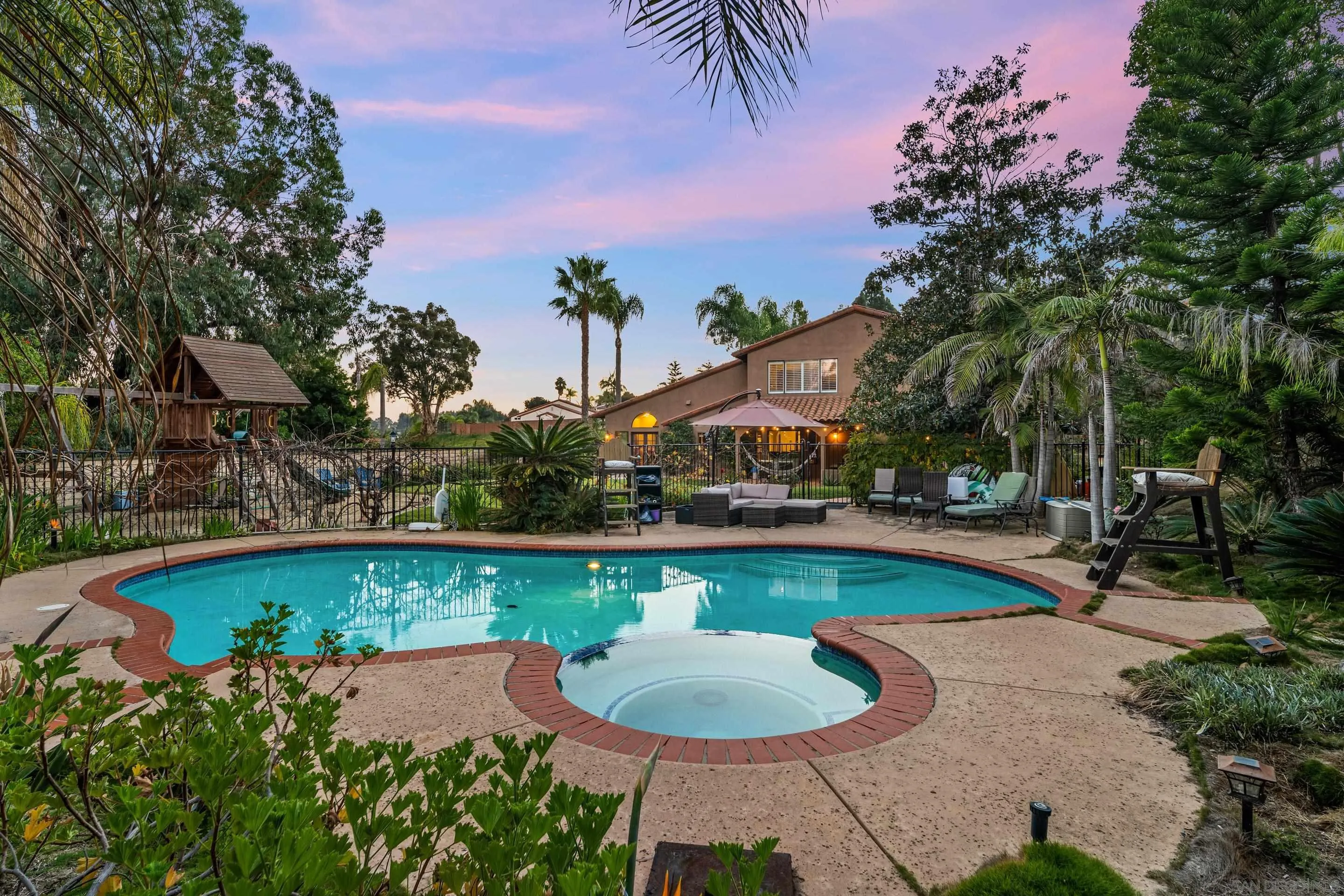 1027 Summer Holly Lane Encinitas, CA 92024 - Photo 4 of 29 a view of a swimming pool with lounge chairs in patio
