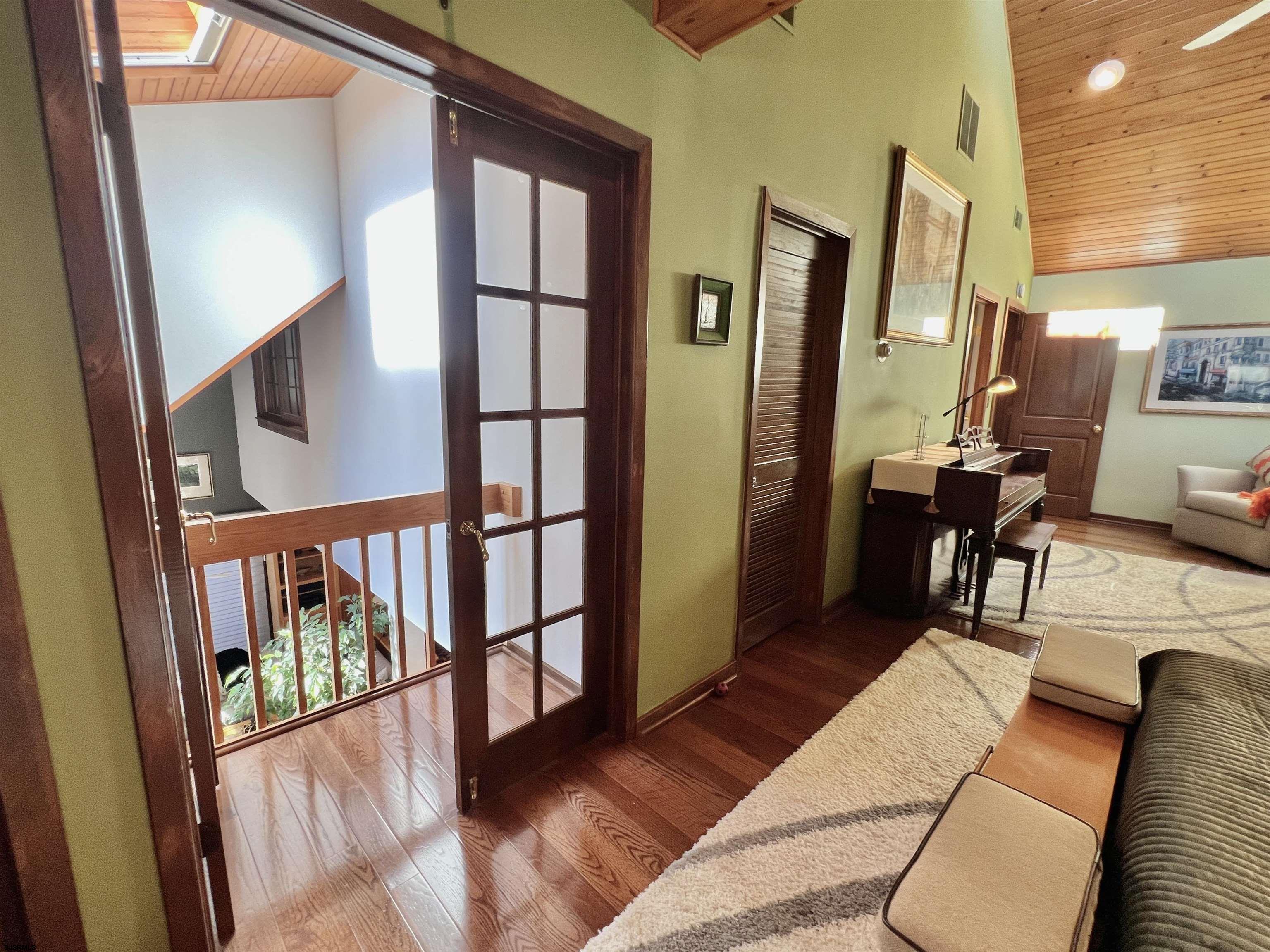 7 North Delavan Avenue, Unit MEMORIAL DAY LABOR DAY Margate City, NJ 08402 - Photo 45 of 60 a view of entryway and hall with wooden floor