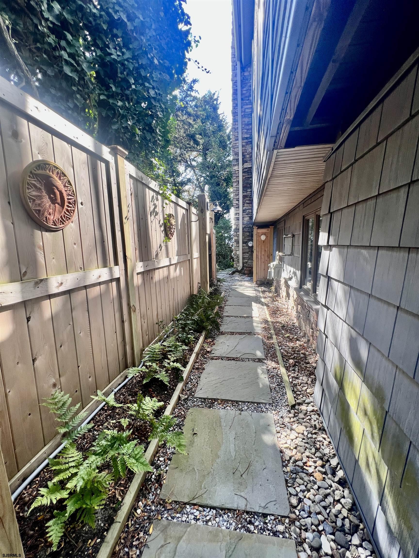 7 North Delavan Avenue, Unit MEMORIAL DAY LABOR DAY Margate City, NJ 08402 - Photo 50 of 60 a view of a backyard with pathway