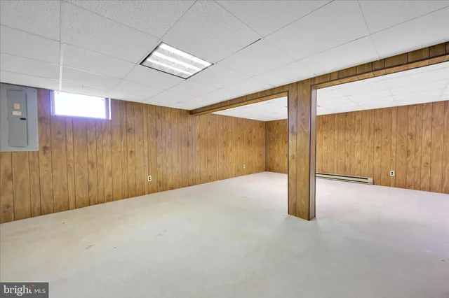 a utility room with cabinets washer and dryer