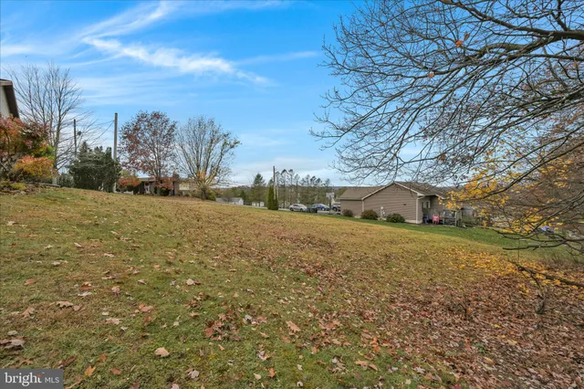 an aerial view of houses with outdoor space