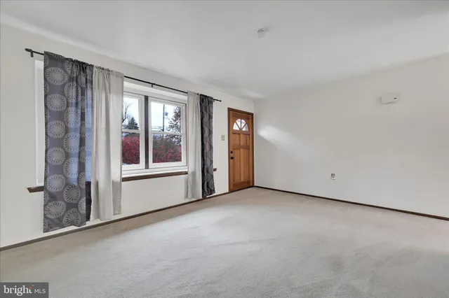 a view of empty room with windows