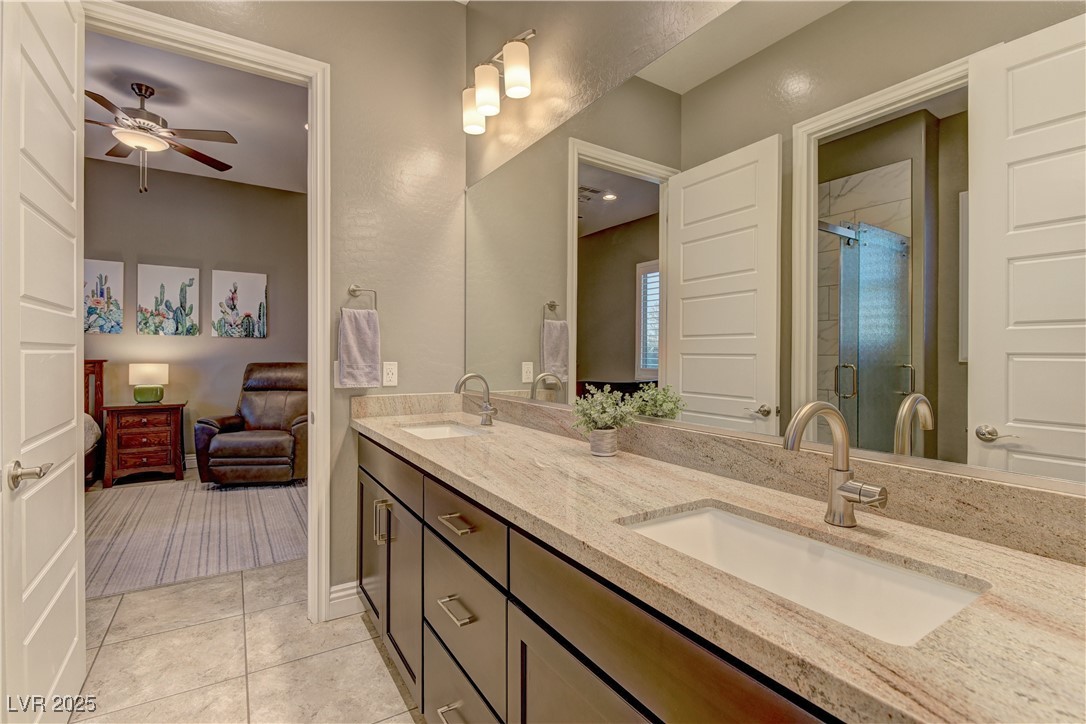 8411 South Cimarron Road Las Vegas, NV 89113 - Photo 26 of 46 Jack and Jill bathroom between bedrooms 3 and 4